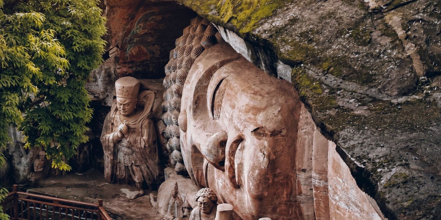 Reclining Buddha of Dazu Rock Carvings with disciple statues at Baodingshan