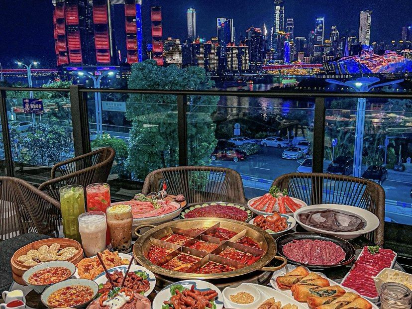 A Chongqing mala hotpot spread with fresh platters